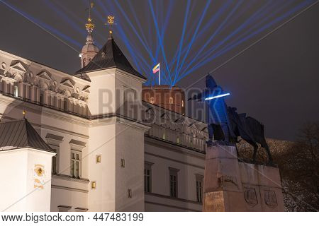 Vilnius Light Festival. Gediminas Statue Or Star Wars Fighter With Sword, At The Cathedral Square Wi