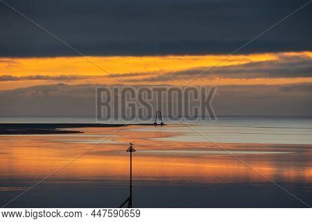 Epic Sunset Landscape Image Of Solway Firth Viewed From Silloth During Stunning Autumn Sunset With D