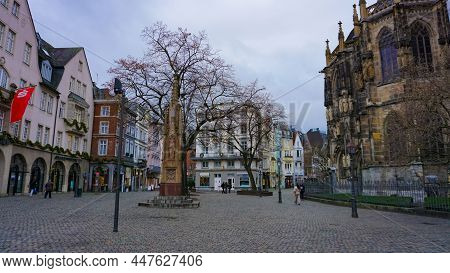 Aachen, Germany - January 03, 2022: People Going At Rathausplatz In The Old Town At Aachen, Germany 