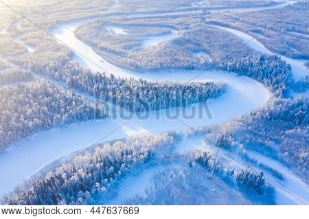 Winter Landscape. Aerial View. Landscape With Winding River And Snowy Forest In Western Siberia. Aga