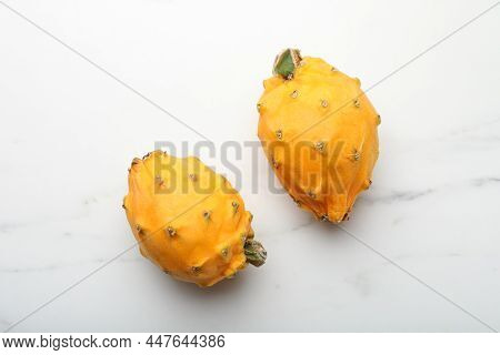 Delicious Yellow Pitahaya Fruits On White Marble Table, Flay Lay