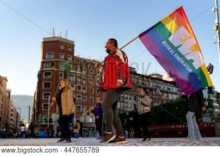 Bilbao, Spain-december 18, 2021 : Group Of Cleaning Worker Protest For Increase Wage. A Man Holding 