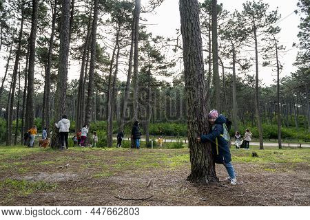 Ovar, Portugal - 30th Of January 2022: People Hugging Trees During The Protest Against The Cutting O