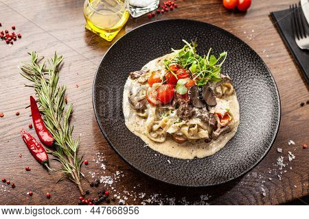 Black Angus Beef Tagliatelle Pasta With Fresh Black Truffles And Parmegano. Delicious Healthy Tradit