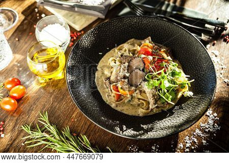 Black Angus Beef Tagliatelle Pasta With Fresh Black Truffles And Parmegano. Delicious Healthy Tradit