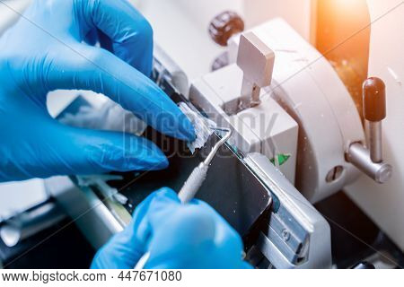 Laboratory Assistant Works On A Rotary Microtome Section And Making Microscope Slides