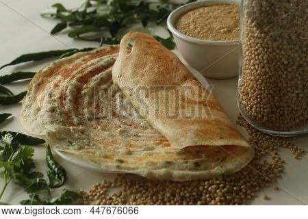 Jowar Dosa. A Savoury Crepe Made Of Jowar Flour. Golden Crispy And Crunchy Dosa Made With Jowar Flou