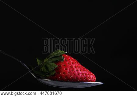 Strawberry Red Berry Isolated On Black Background.