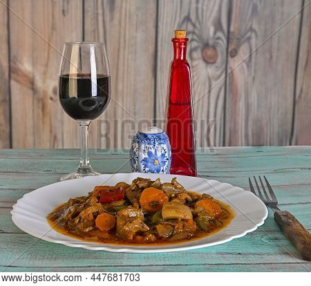 Octopus Stew With Onions, And A Glass Of Wine.