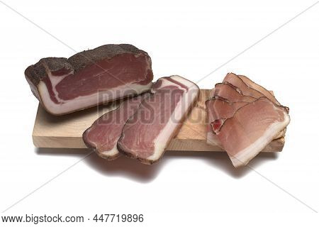 Close Up Of A Large Piece Of South Tyrolean Square Bacon Next To Thicker Sheaves And Thin Leaves On 