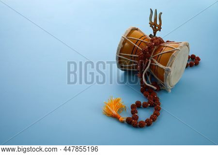 Shivaratri Background With Shivas Trident And Pellet Drum Damroo Musical Instrument . Hindu Festival