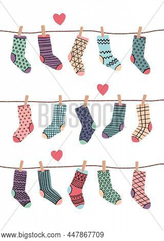 Funny Socks In Different Colors Hanging On A Rop