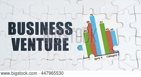 On White Puzzles There Is An Inscription - Business Venture. Financial Graph In The Window Among The