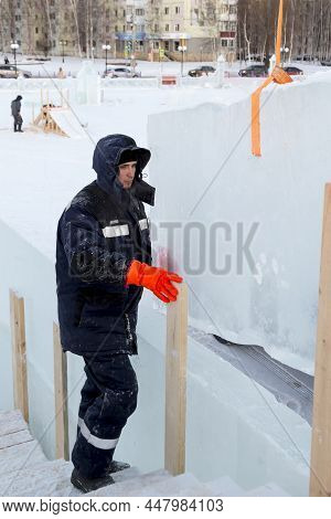 Worker On The Installation Of An Ice Panel