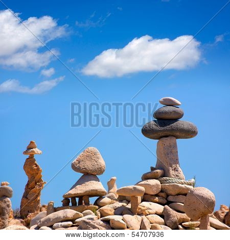 Stone figures on beach shore of Illetes beach in Formentera Mediterranean Balearic Islands