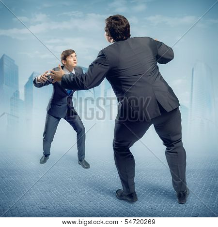 two businessmen fighting as sumoist