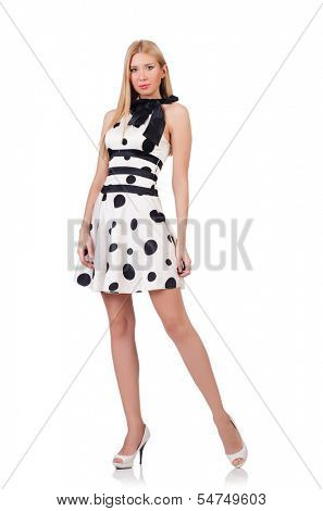 Tall model dressed in dress with polka dosts on white