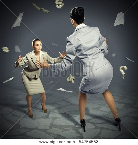 two businesswomen fighting as sumoist