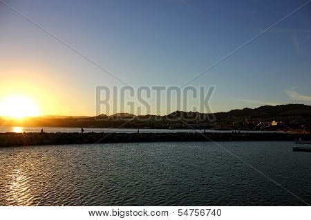 Sunset over the mountains and the sea