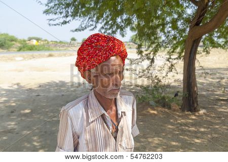 A Rajasthani Tribal Man Wearing Traditional Colorful Turban