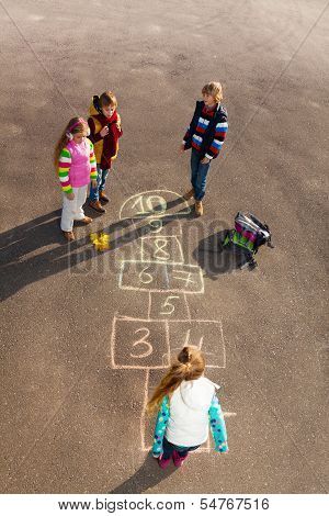 Kids Play Hopscotch