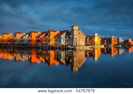 Beautiful Colorful Buildings On Water In Gold Sunshine