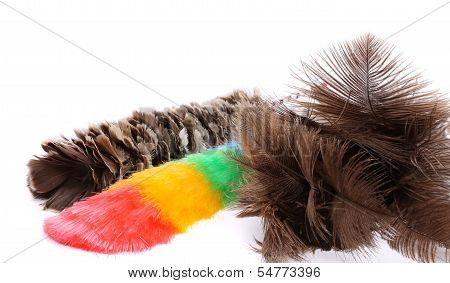 Three different dusters on a white background