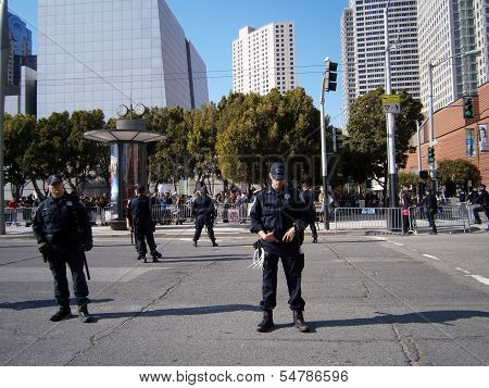 Sfpd Police Officers Stand On Street As Protesters Of Marijuana Rights Stand Behind Fence