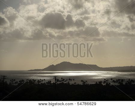 Light Shines Through The Clouds On Diamondhead At Dusk