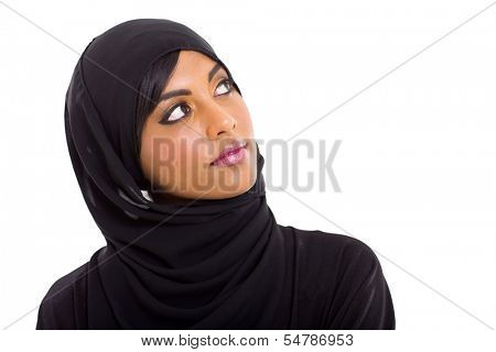 pretty muslim woman looking up on white background