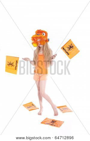 Young Blond Girl With Orange Hat Waving Flags In Studio