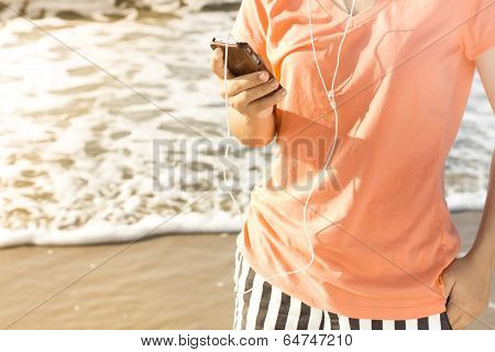 Woman using a smartphone enjoy listening to music lifestyle , Filtered images color effect