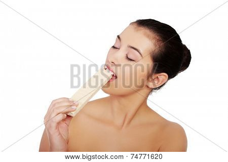 Beautiful woman eating a waffer