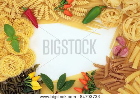 Pasta dried food abstract border with herbs and spices over white background.