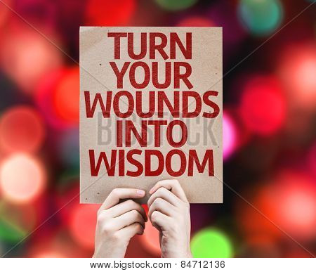 Turn Your Wounds Into Wisdom card with colorful background with defocused lights