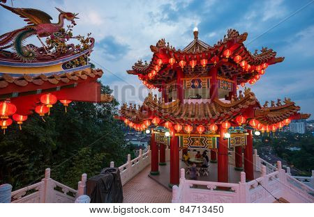 KUALA LUMPUR, MALAYSIA - FEBRUARY 23, 2015: Tourists visit the scenic Thean Hou Temple at night with hundreds of lanterns hung across the courtyard celebrating the lunar Chinese New Year.