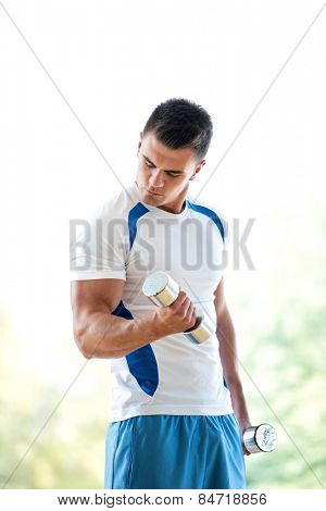 young man in fintess sport club exercise with weights and relaxing