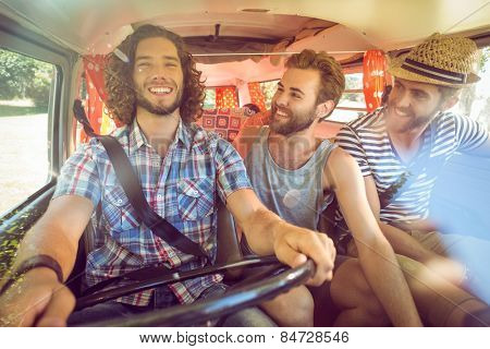 Hipster friends on road trip on a summers day