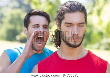 Tough trainer shouting at his client on a sunny day