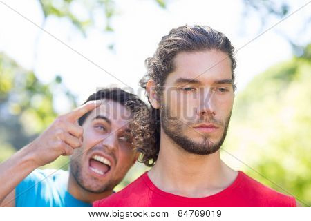 Tough trainer shouting at his client on a sunny day