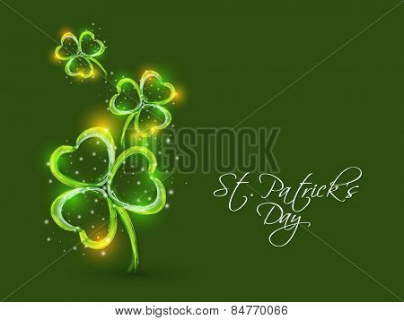 Happy St. Patrick's Day celebration with shiny shamrock leaves design on green background.