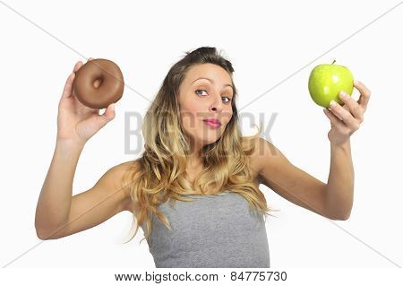 Attractive Woman Holding Apple And Chocolate Donut In Healthy Fruit Versus Sweet Junk Food Temptatio