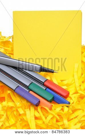 Markers with yellow sticky notes