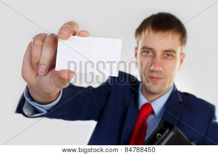A man with a business card and portfoli