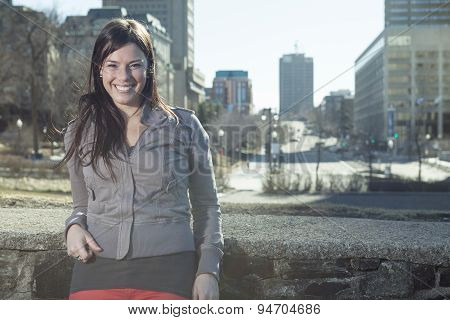 young beauty posing over city background