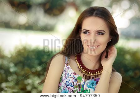 Smiling Woman Wearing Floral Dress and Big Necklace