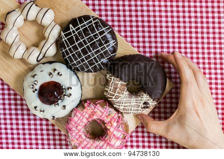 Hand Taking Doughnut Or Donut During Coffee Break