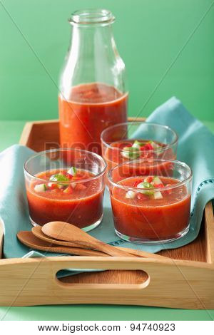 cold gazpacho soup in glass and ingredients