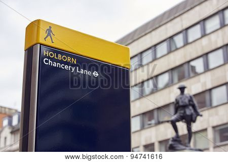 LONDON, UK - JUNE 23: Chancery Lane Station sign with war memorial in the background. June 23, 2015 in London.