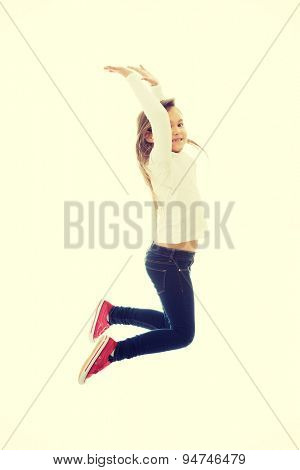 Little pretty girl jumping with joy